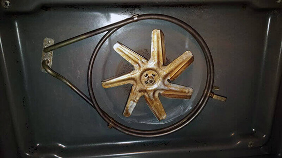 The oven fan before the cleaning